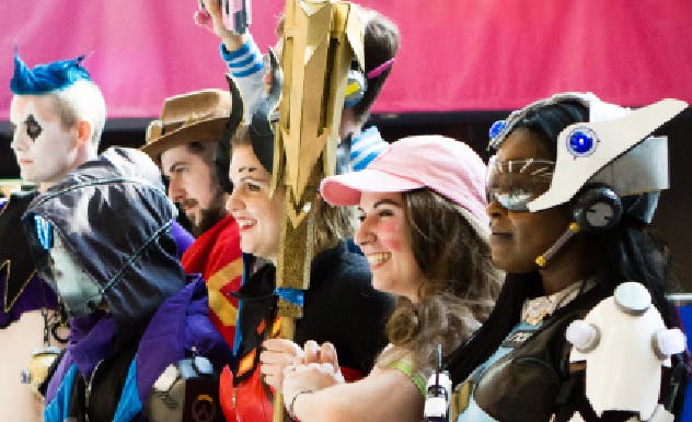 Two fans pose in Batman cosplay at MEGACON Orlando