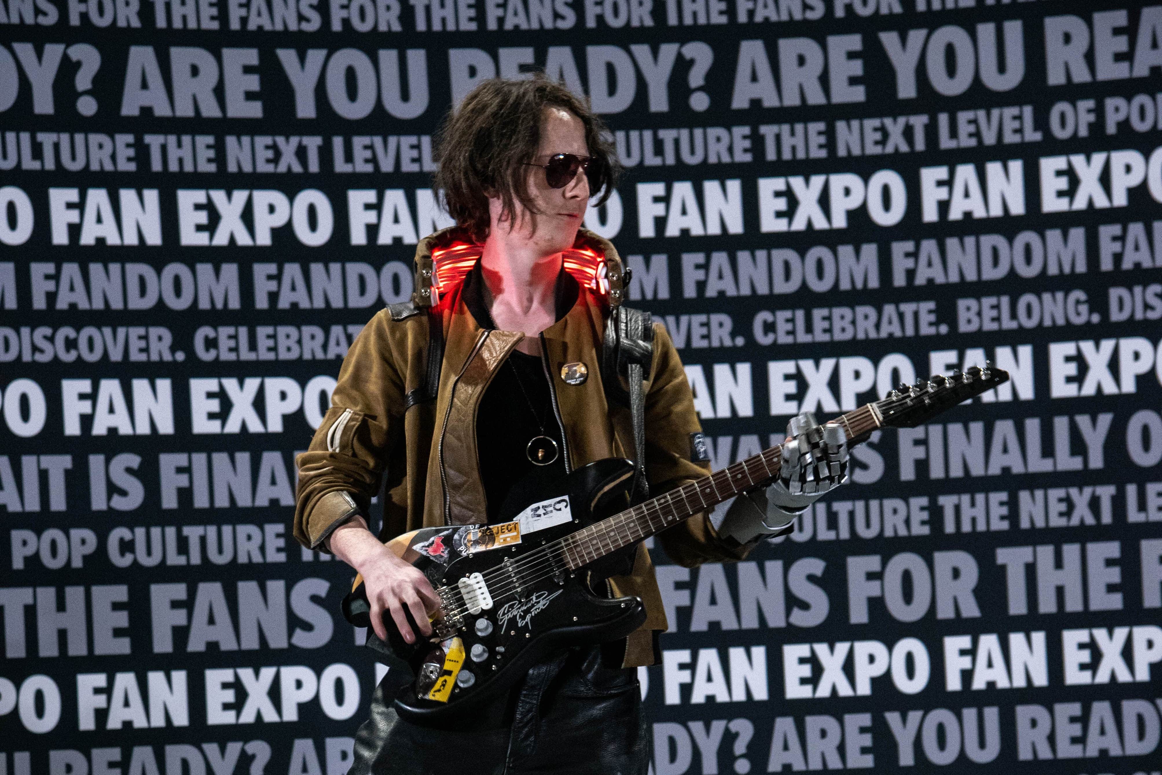 One of the Cosplay Craftsmanship Cup contestants on stage, cosplaying as Johnny Silverhand from Cyberpunk.