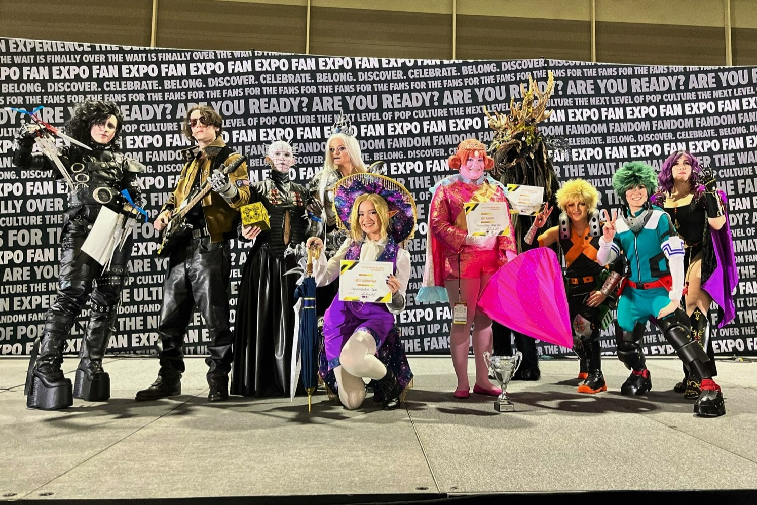 The winners of the FAN EXPO New Orleans Craftsmanship Cup posing in a photo alongside the judges.