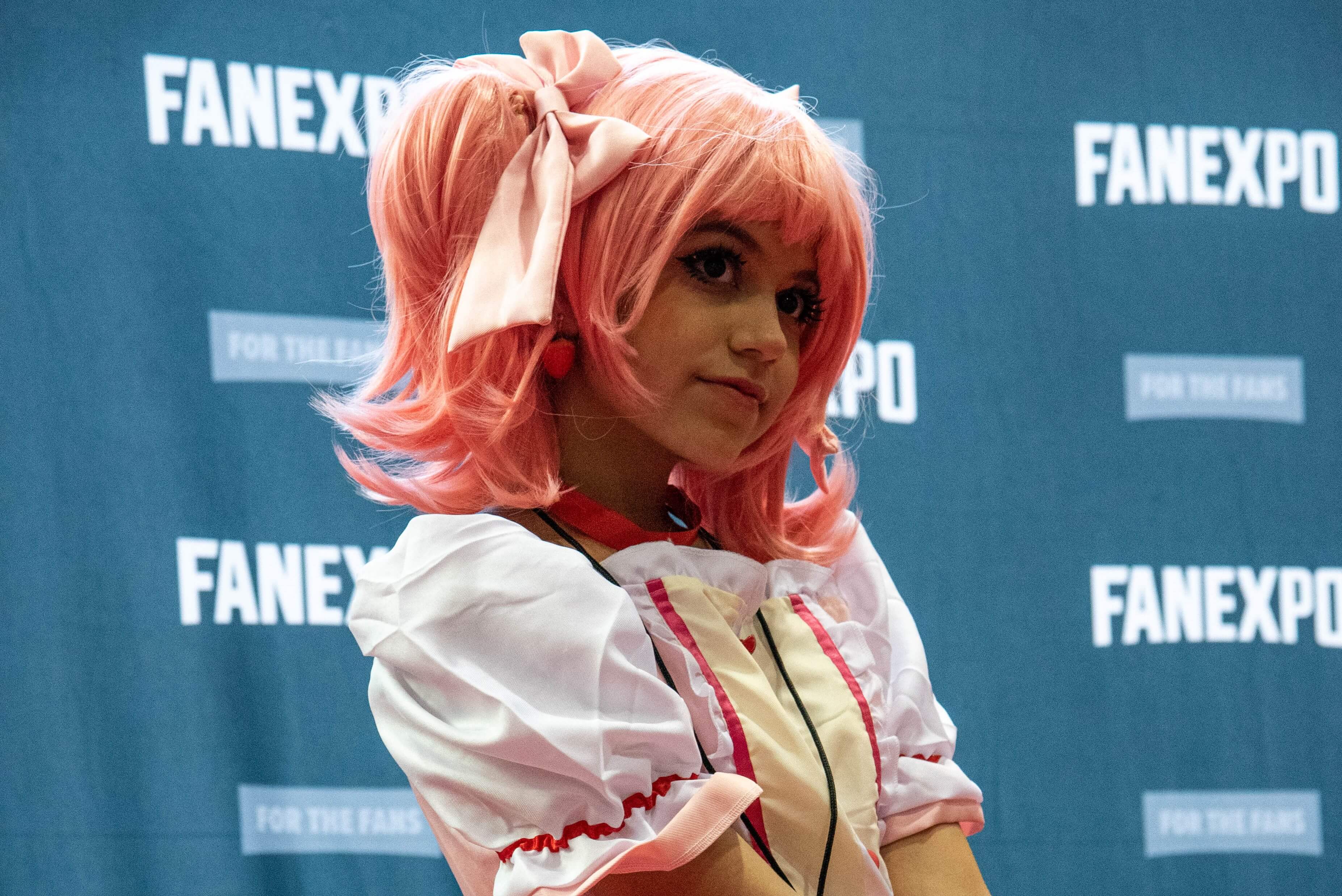 A cosplayer dressed up as Madoka from Madoka Magica.