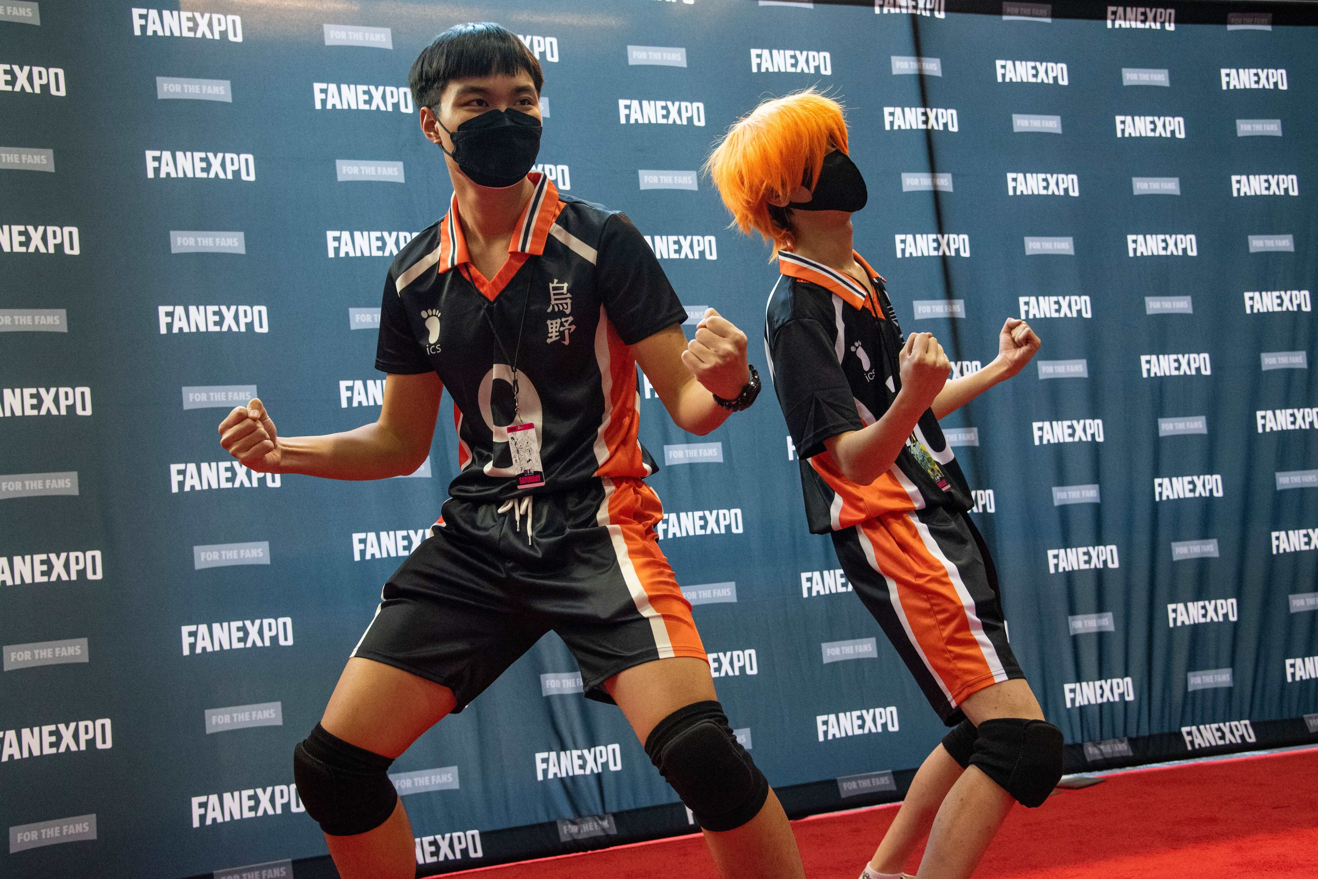 A duo of cosplayers dressed up as Kageyama and Hinata from Haikyu.
