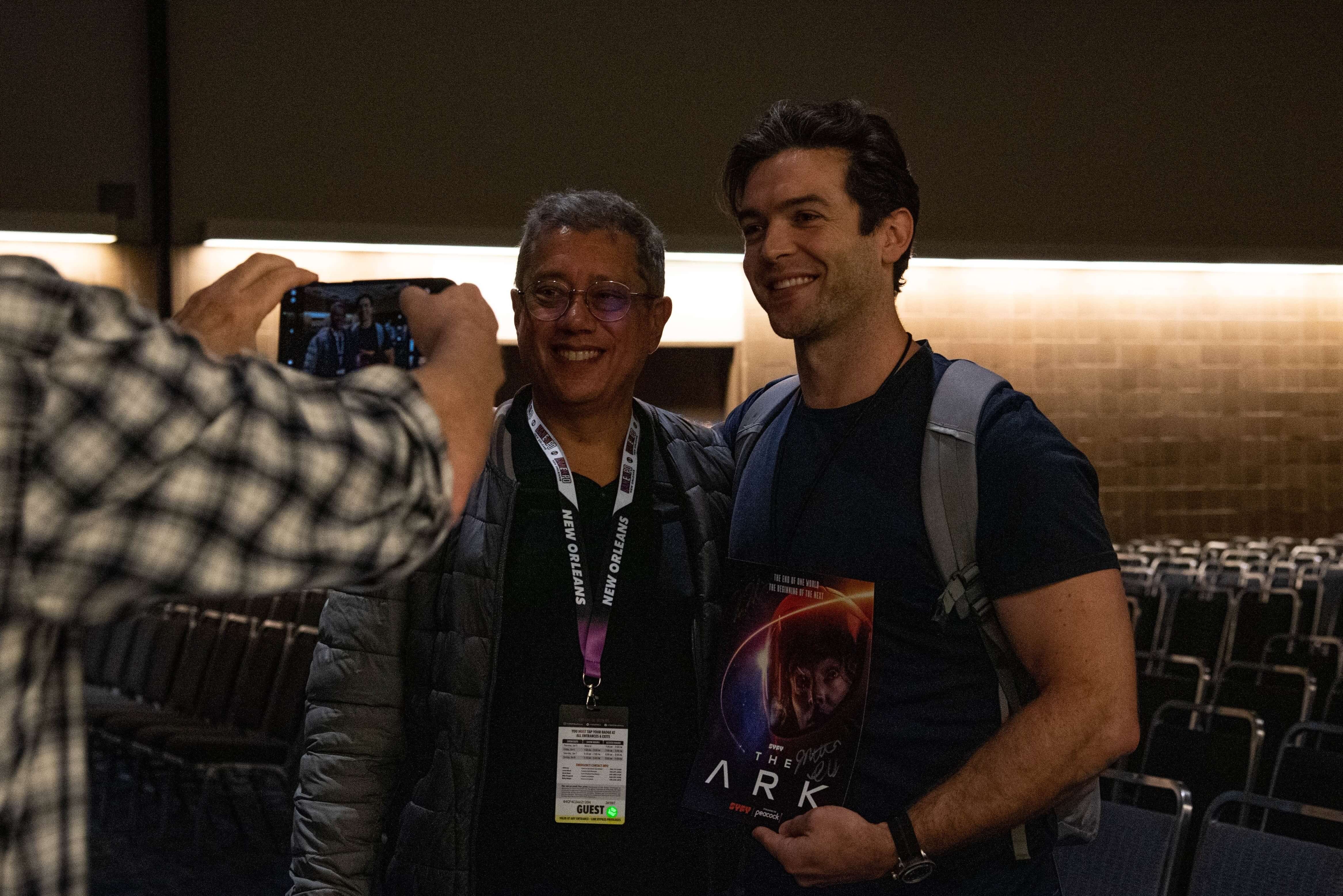 Ethan Peck making a surprise appearance at The Ark panel, here taking a photo with Dean Devlin.