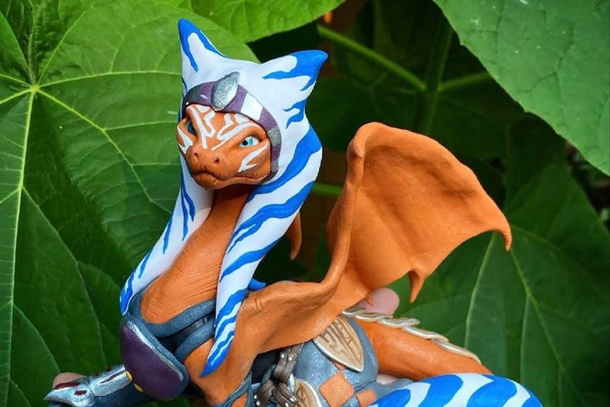 A clay sculpture of a dragon painted like Ahsoka
