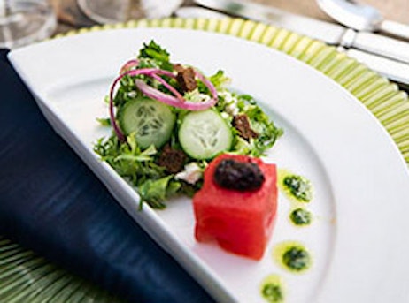 salad on a plate with fish
