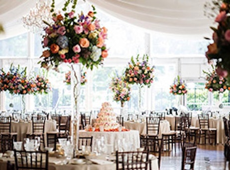 white decorated event with pink cake