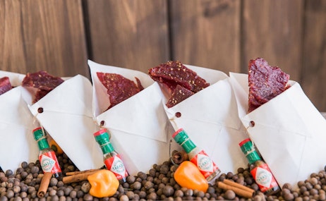 Mini nacho chips with hot sauce