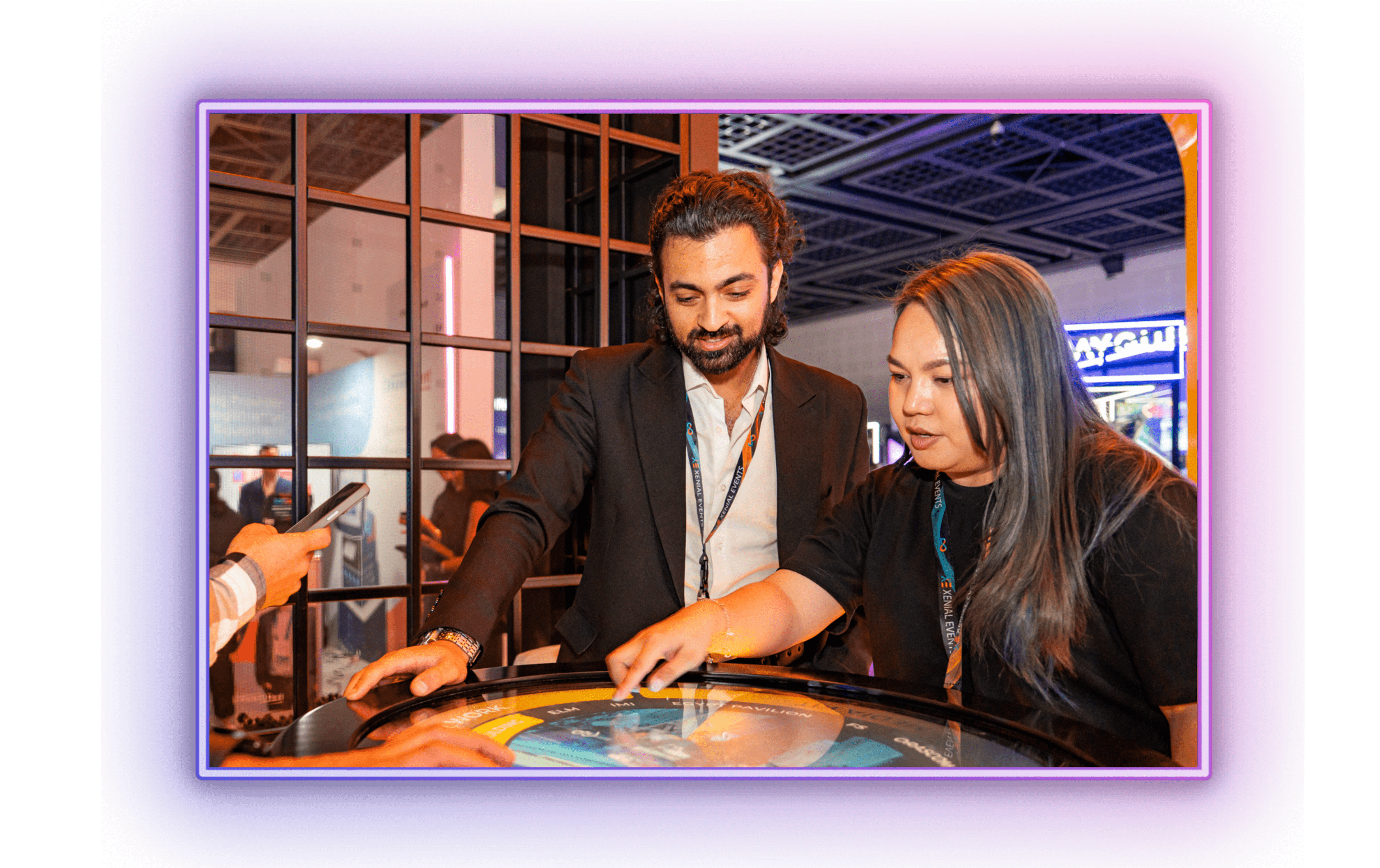 Visitors exploring interactive event tech and AV solutions at MEES expo, showcasing innovations in stage and production design.