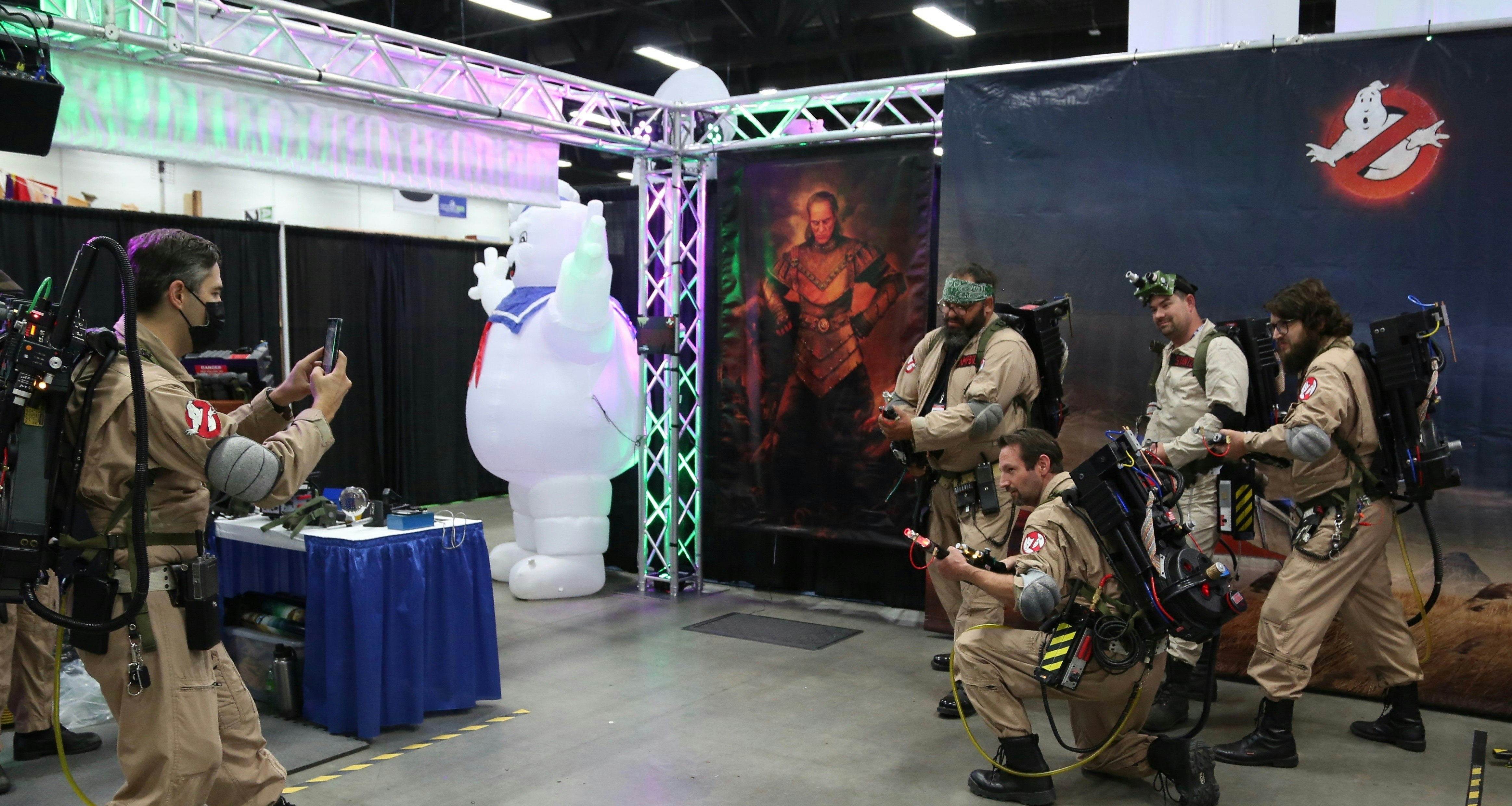 Alberta Ghostbusters posing, ready to hunt the stay puff marshmallow man in the background