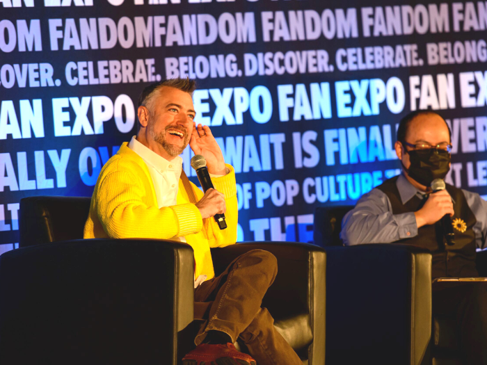 Sean Gunn with a moderator at his panel at FAN EXPO Vancouver