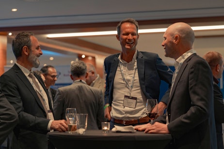 Men networking at Flame