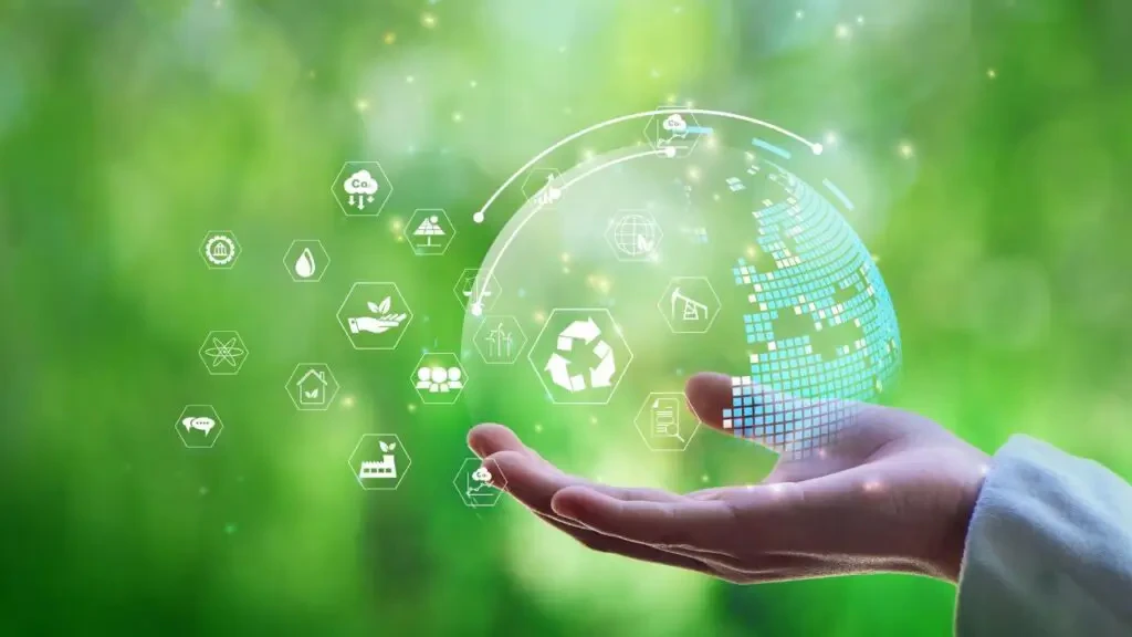 Mão aberta sustentando projeção holográfica do planeta Terra e ícones de sustentabilidade e tecnologia ESG sobre fundo verde, ilustrando o HIS - Healthcare Innovation Show 2026.