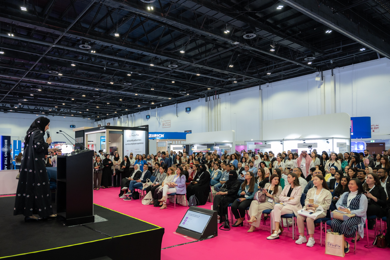 Diverse audience listening to a presenter at HRSE KSA