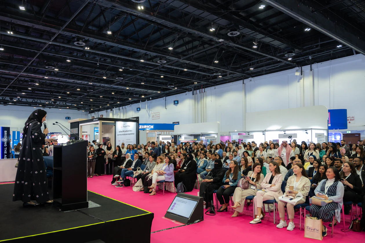 Diverse audience listening to a presenter at HRSE Summit.