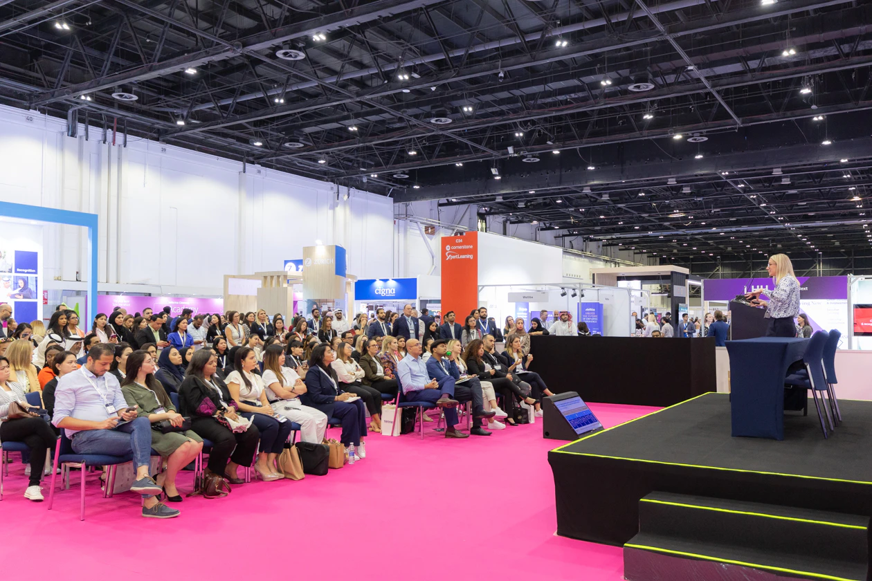 Speaker presenting to audience at HRSE Summit.