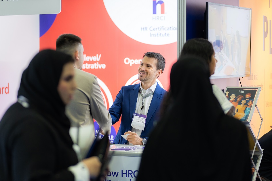 Delegates engaging with HR Certification Institute exhibitor at HRSE Dubai 2025, exploring HR qualifications and learning solutions.