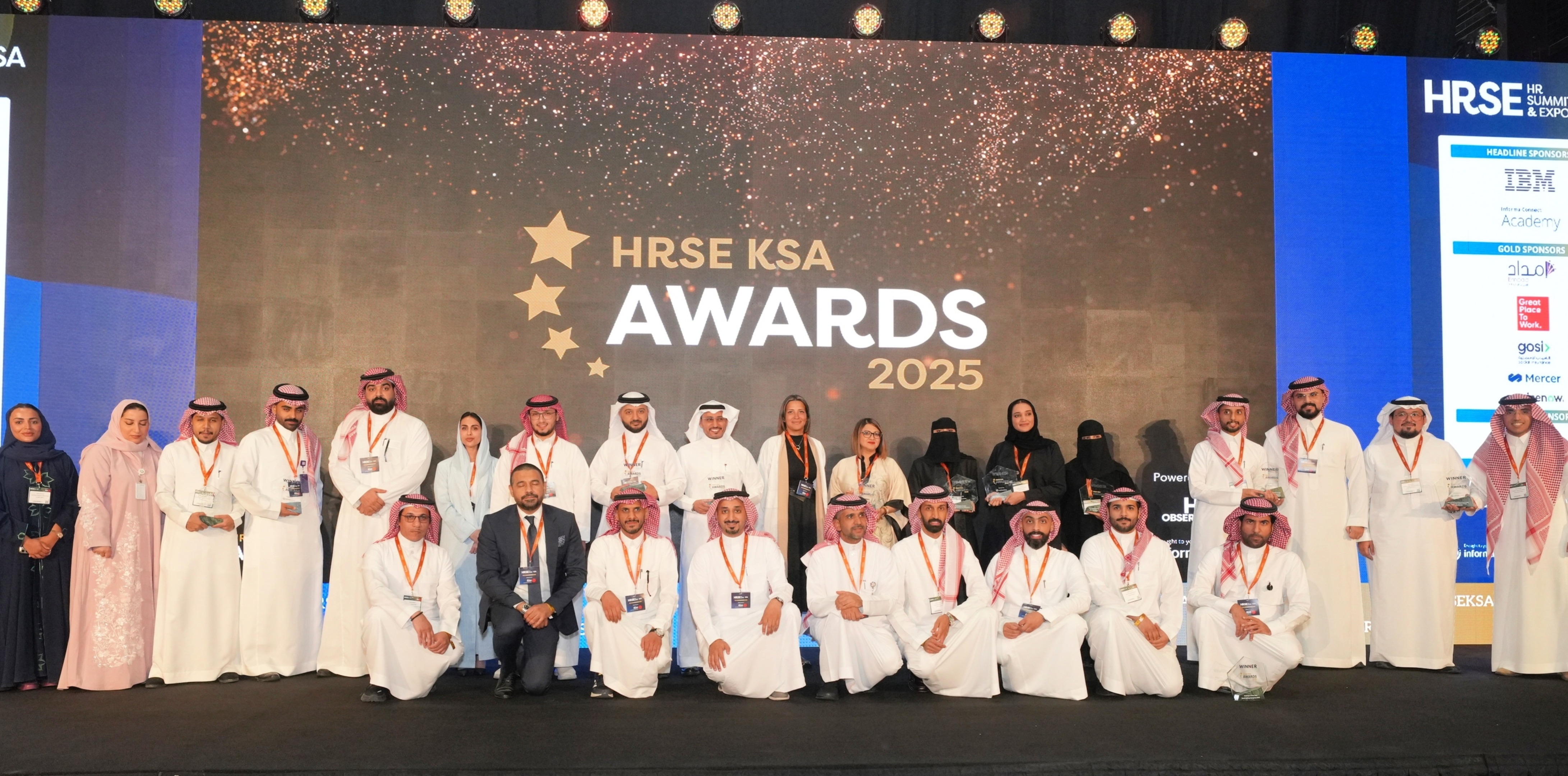 Professionals networking at HRSE Summit with various booths