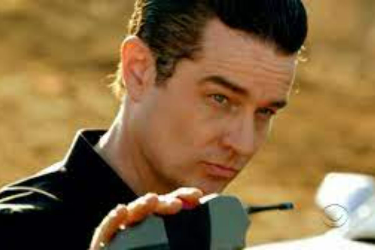 James Marsters holding a walkie talkie