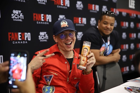 Logic posing with his prayer candle