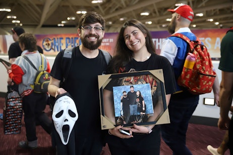 Scream fans holding up their autographed merch and photo op