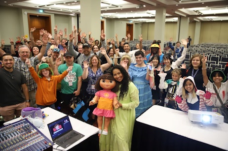 Kathleen Herles posing with fans after her panel