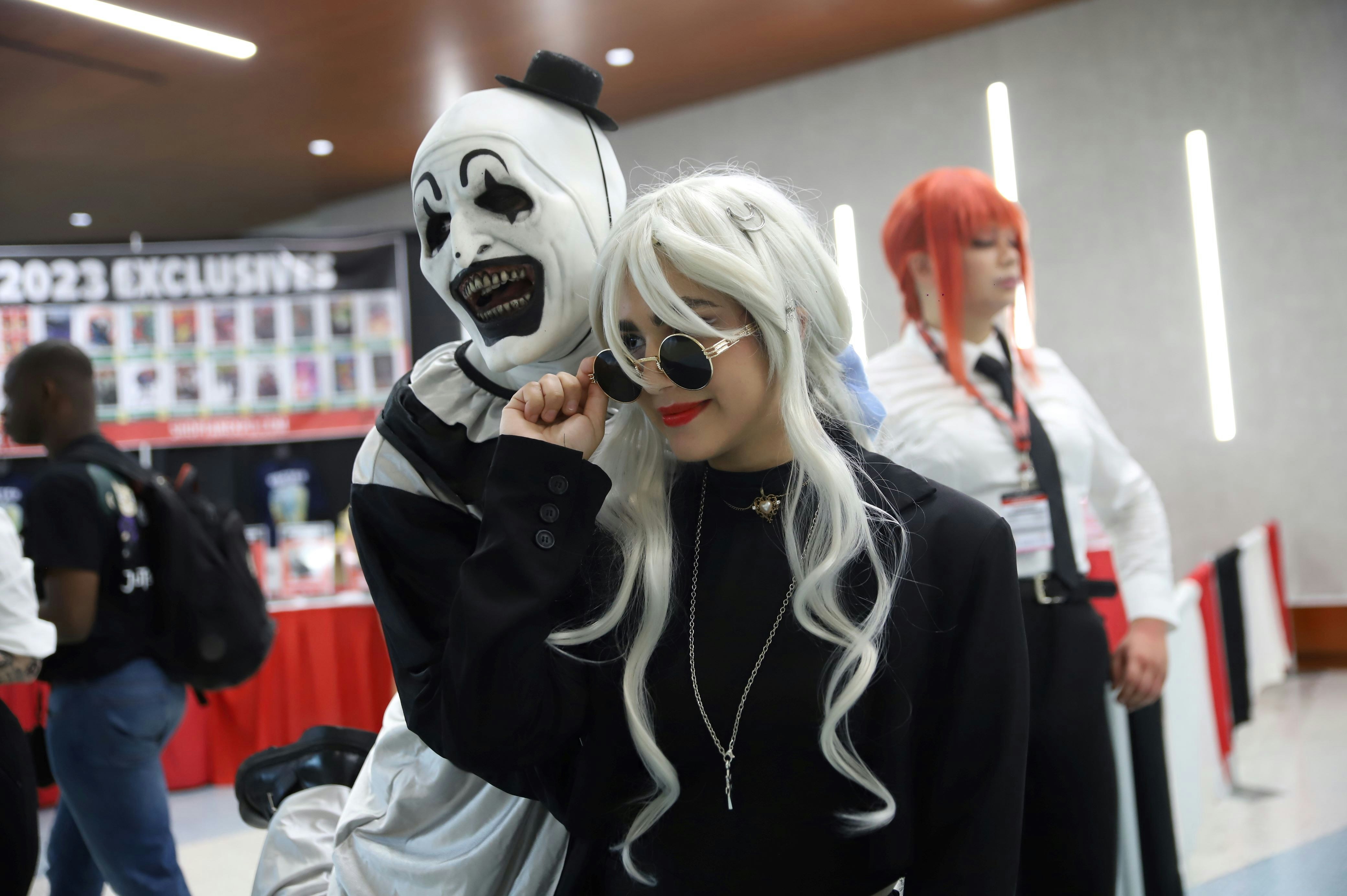 COSPLAYERS POSE FOR THE CAMERA