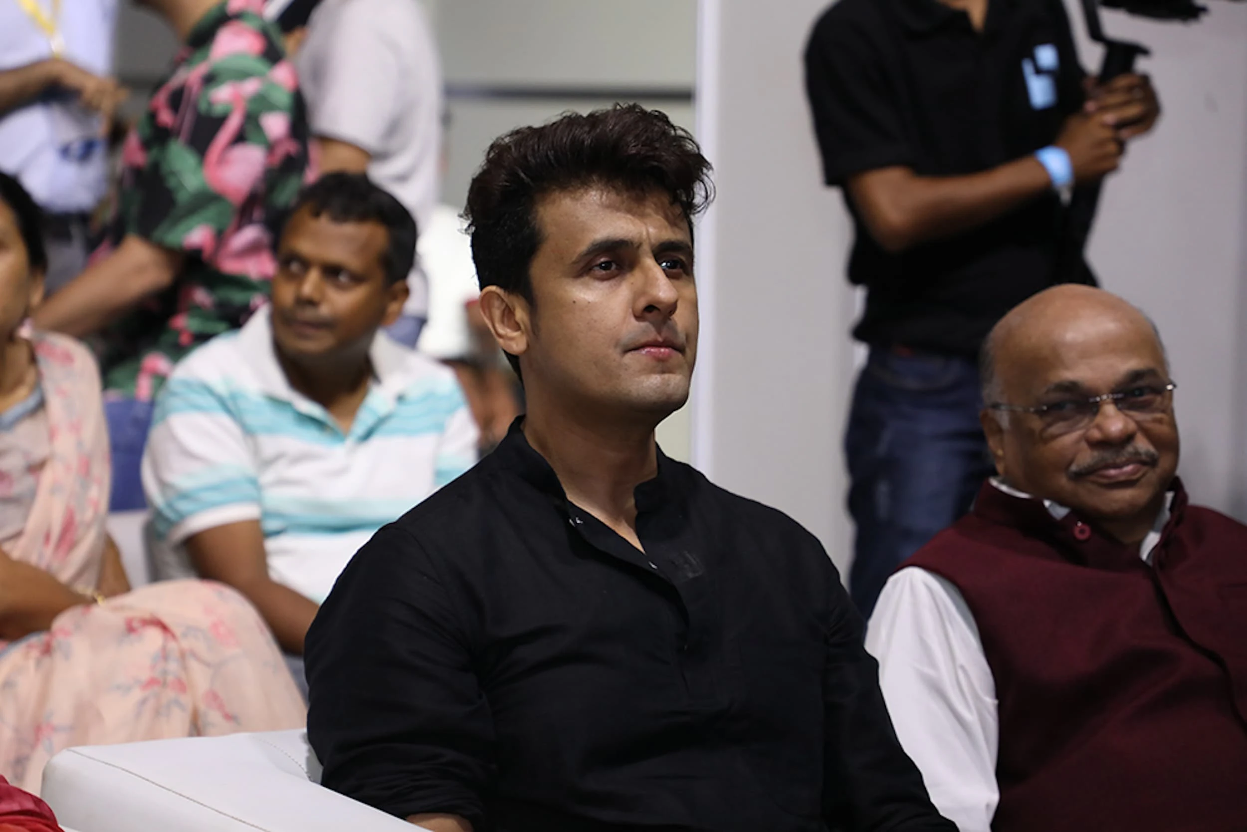 Close-up of an attendee watching the IRAA Palm Awards ceremony.