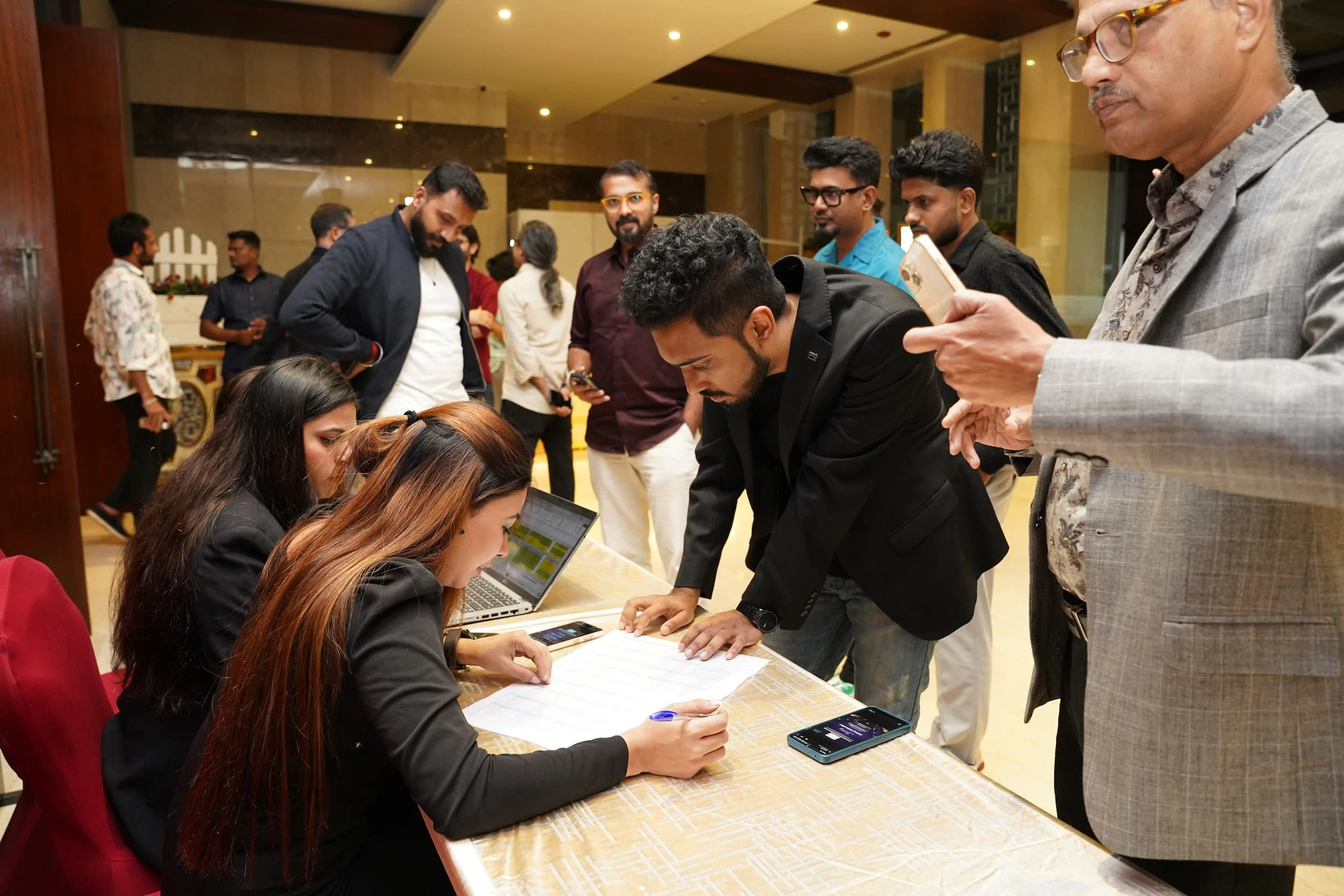Attendees gathered around the registration desk at the IRAA Palm Awards