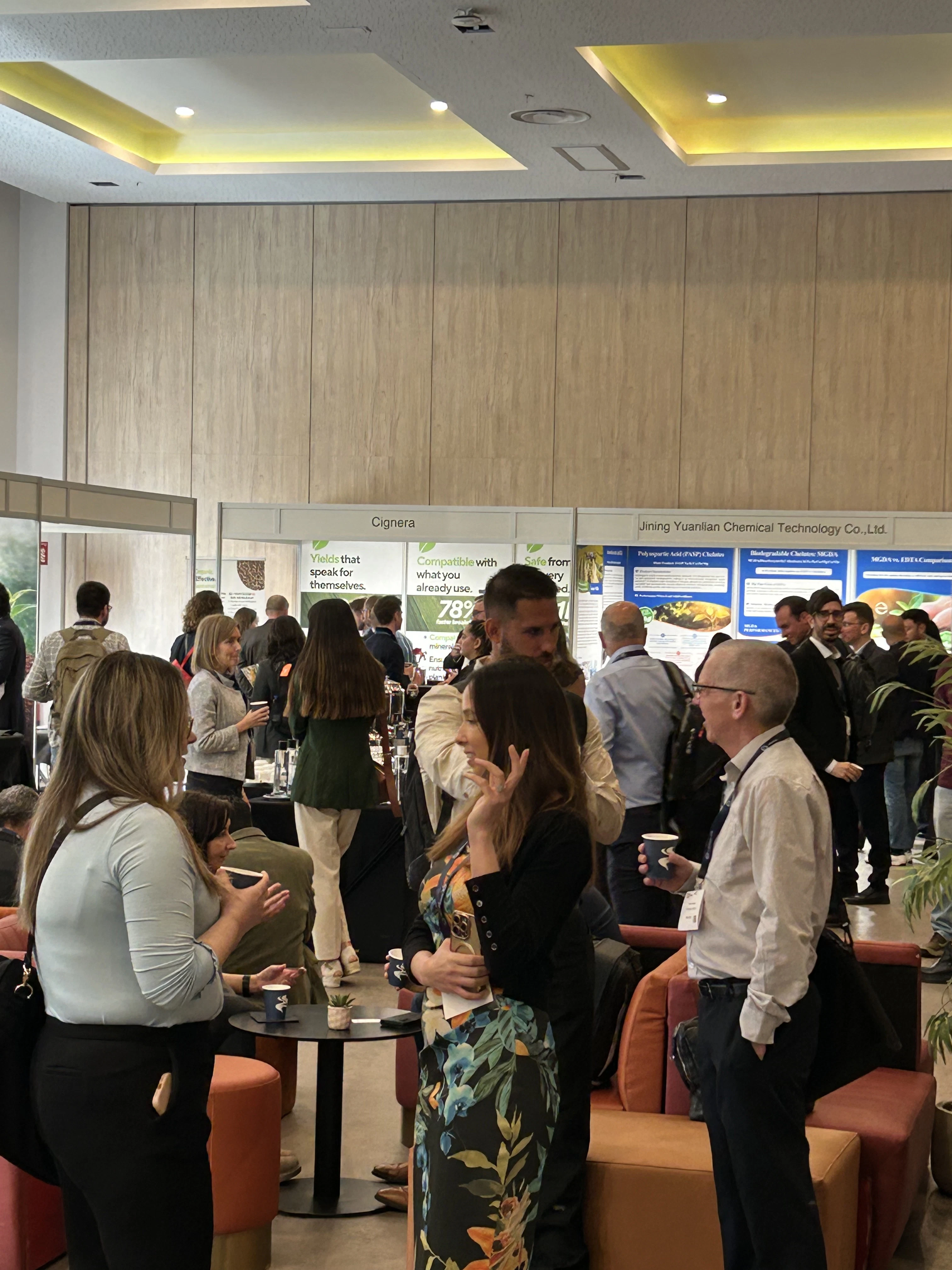 Delegates networking at the exhibition hall during the New Ag International Annual, connecting with BioAg industry professionals and suppliers