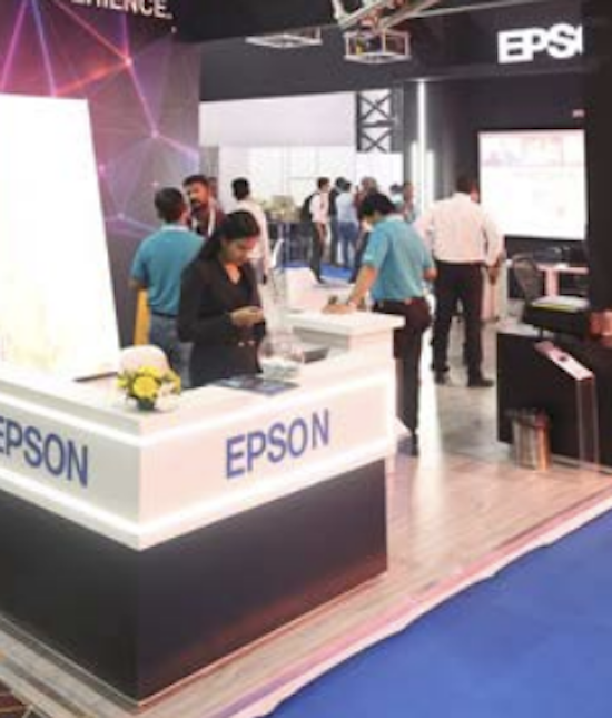 Booth hostess welcoming visitors at an exhibition stand