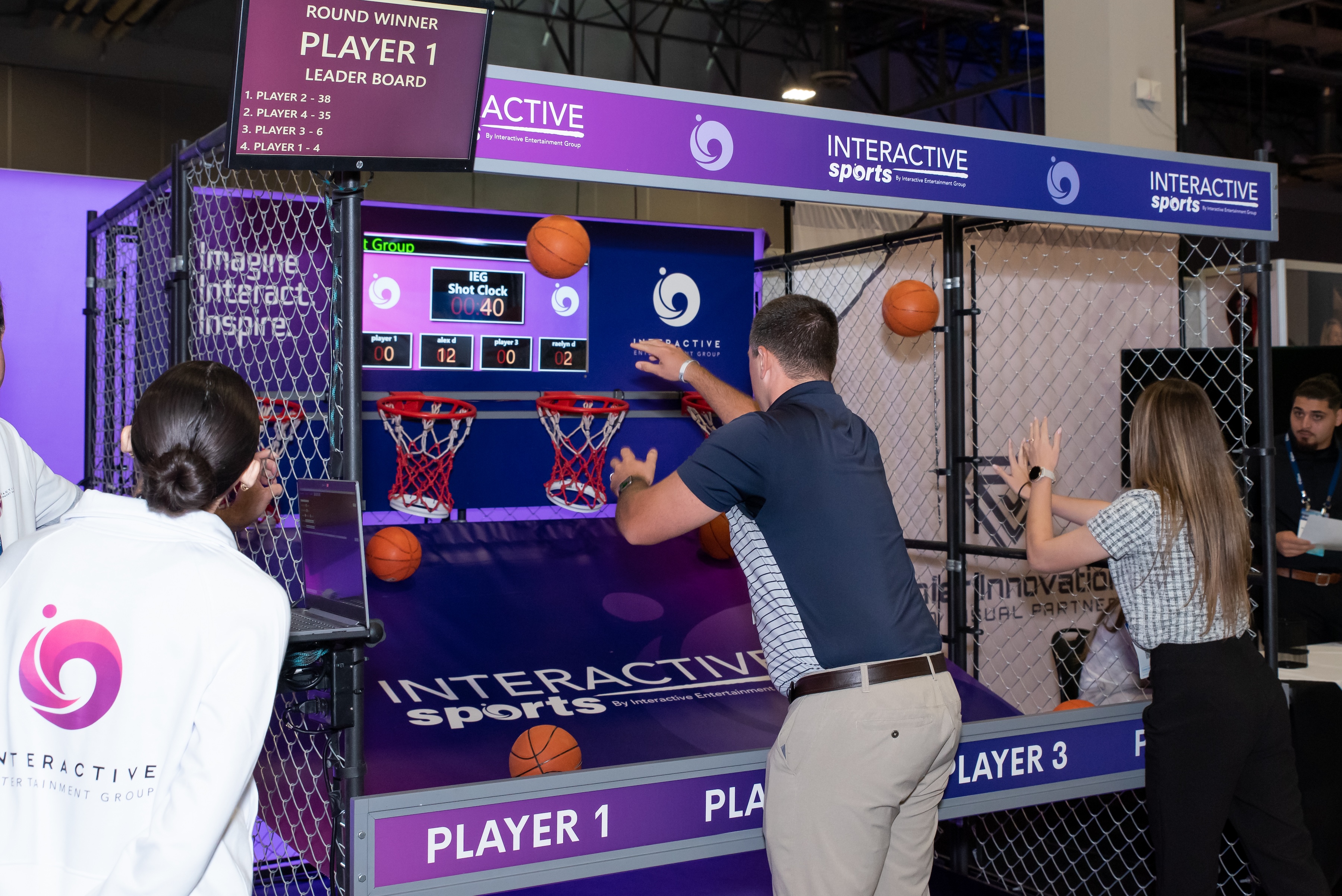 Man playing basketball in the Interactive Entertainment Group trade show booth
