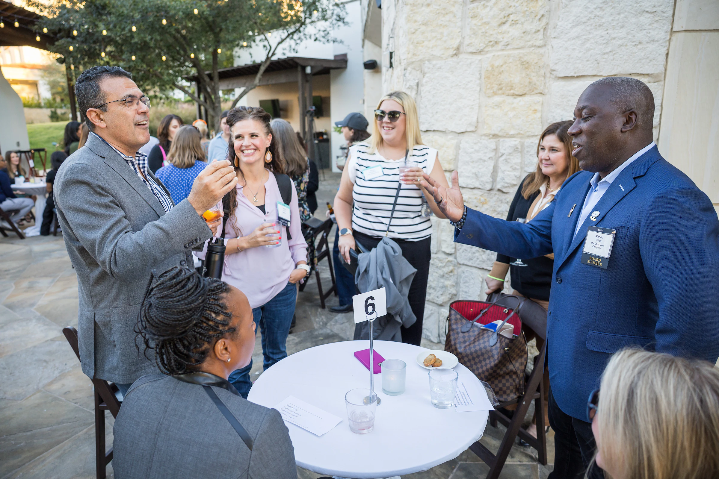Image of attendees talking.