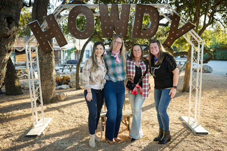 CSW Attendees Standing with a Howdy Sign