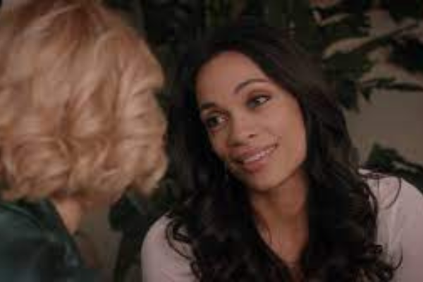 Rosario Dawson in Jane the VIgin and is smiling at Petra.