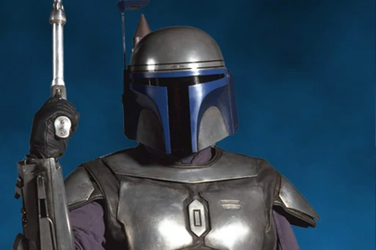 Jango Fett poses with his blaster on a solid blue backdrop