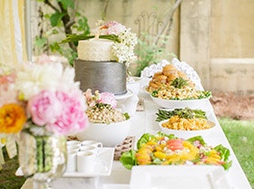 outdoor dessert table with grey and white cake