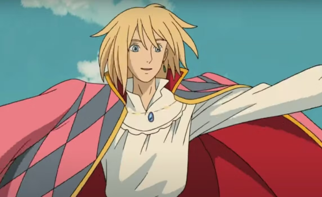 With his right arm extended, Howl (blonde) stands in a white shirt, with his blue and pink jacket hanging off of his shoulders.