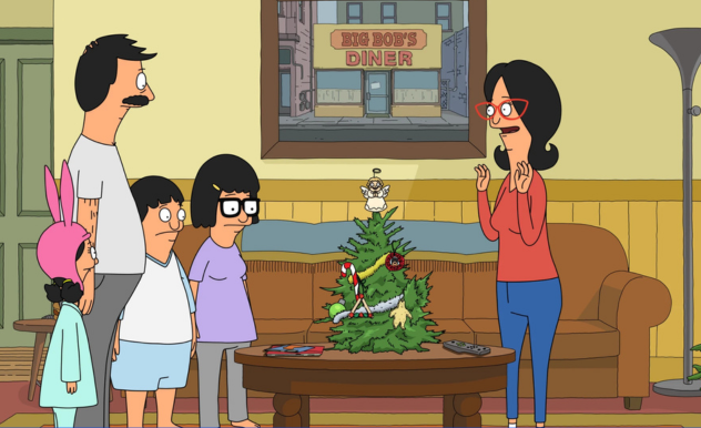 The Belcher's stand in their living room around a small tree with handmade ornaments - Linda is excited, but the rest of the family looks unsure.