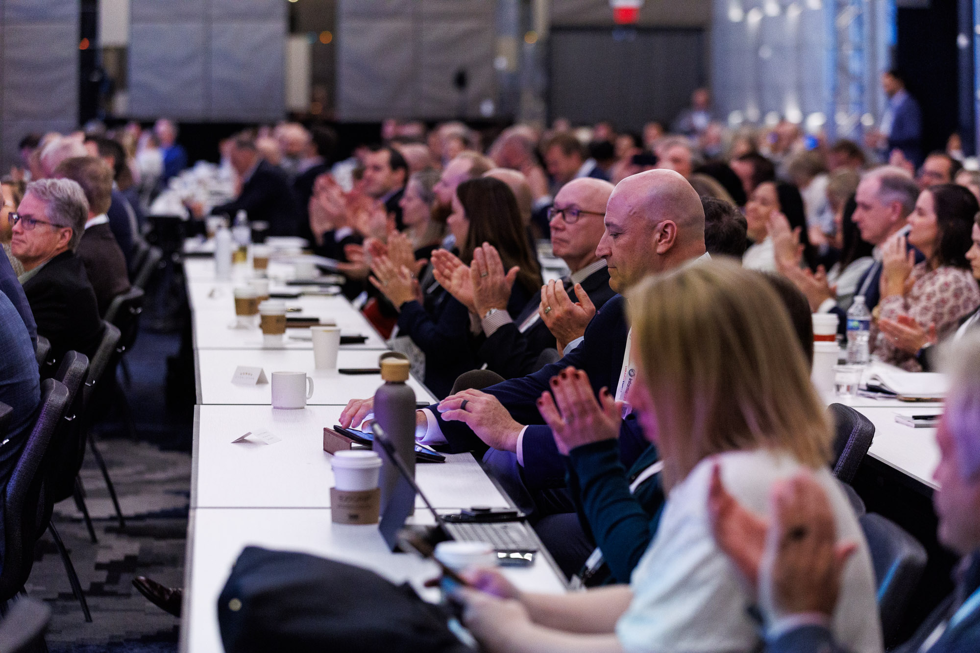 Pharma professionals applaude after presentation at Trade and Channel Strategies