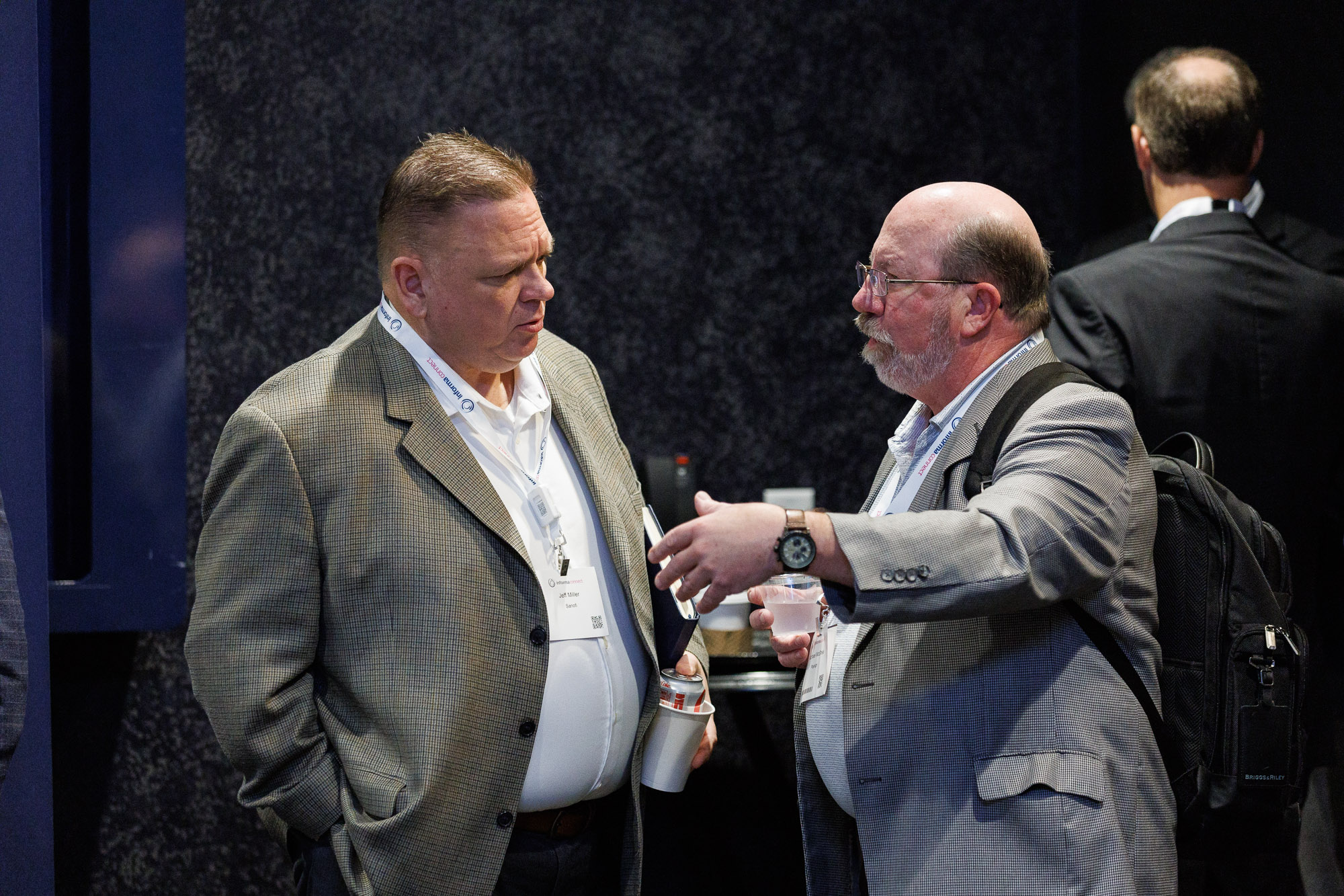 Two men network at Trade and Channel Strategies