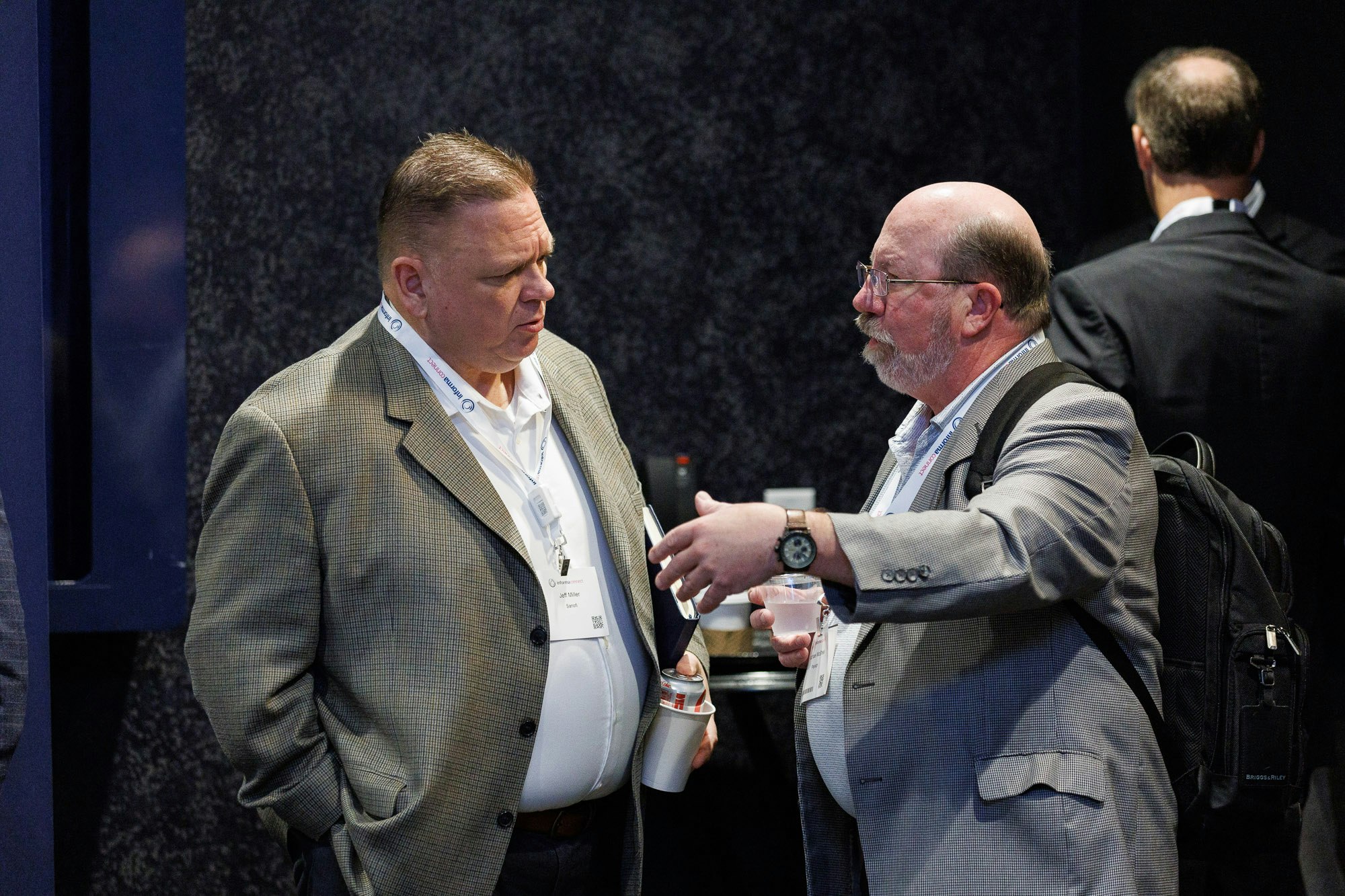 Two men network at Trade and Channel Strategies