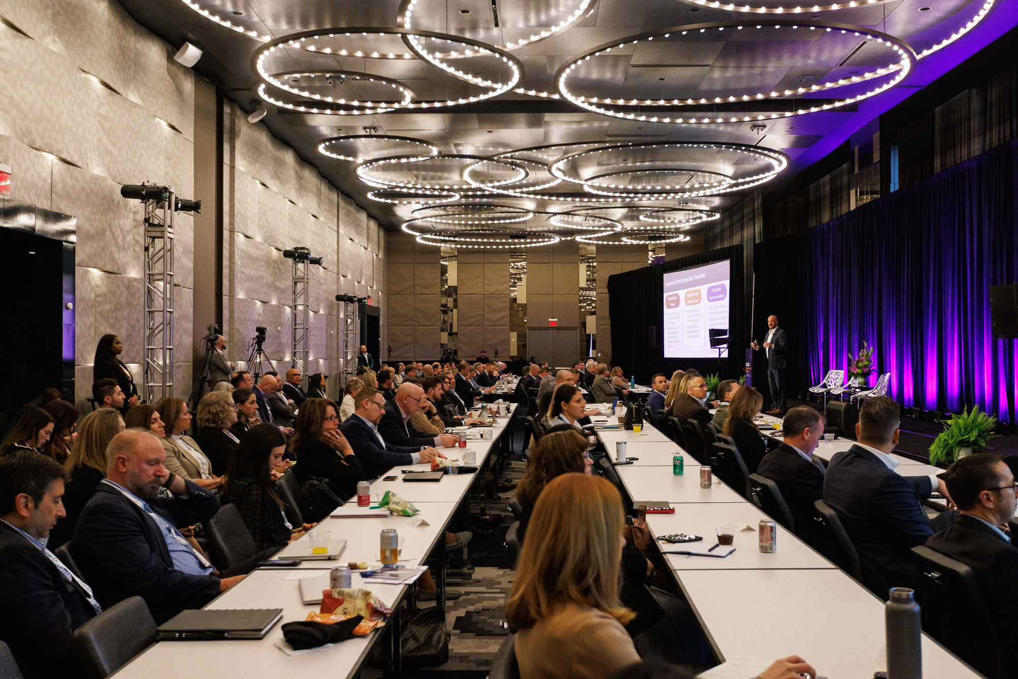 A room full of pharma professionals attend a presentation at Trade and Channel Strategies