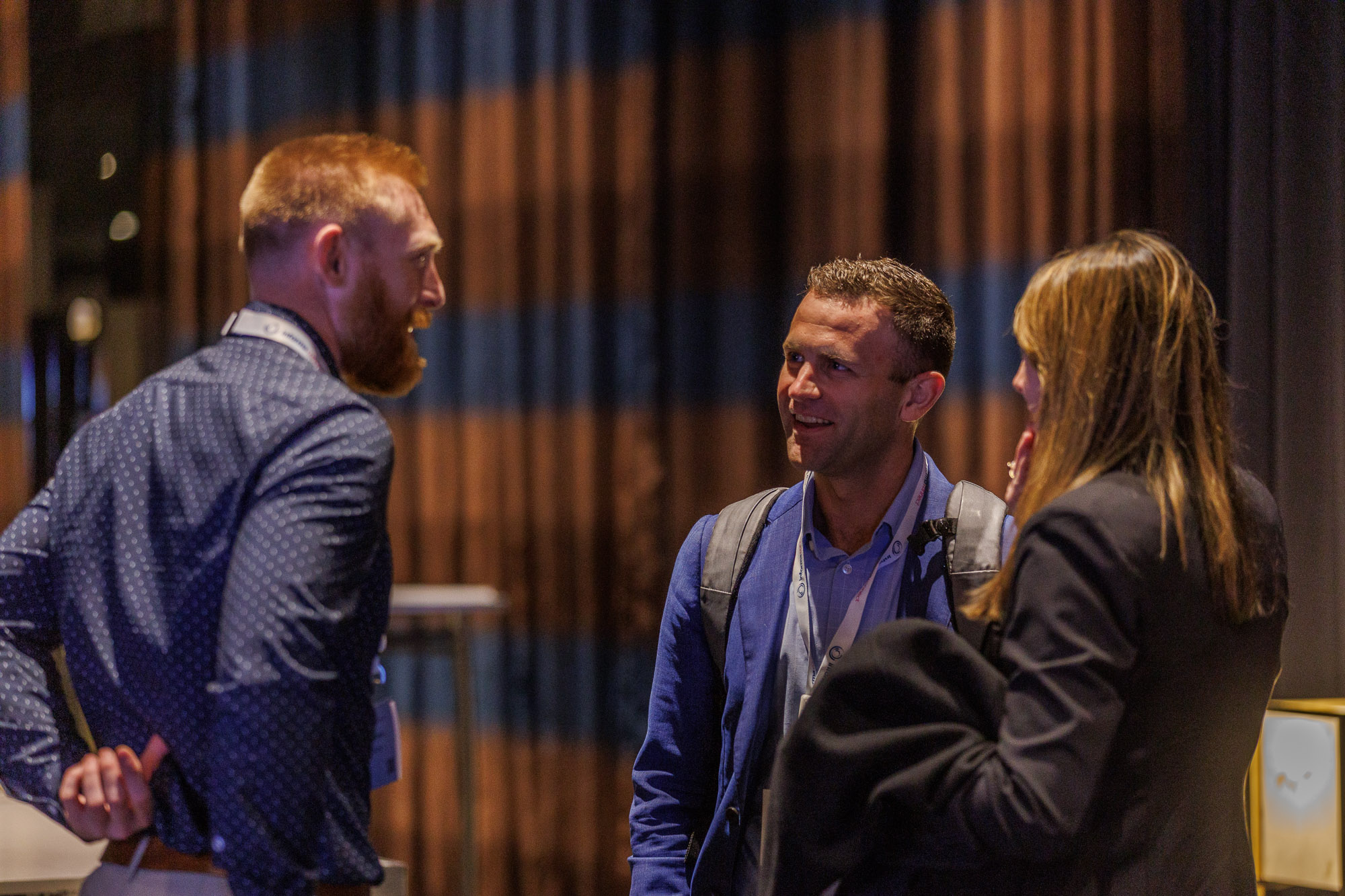 Three trade and channel professionals network at Trade and Channel Strategies