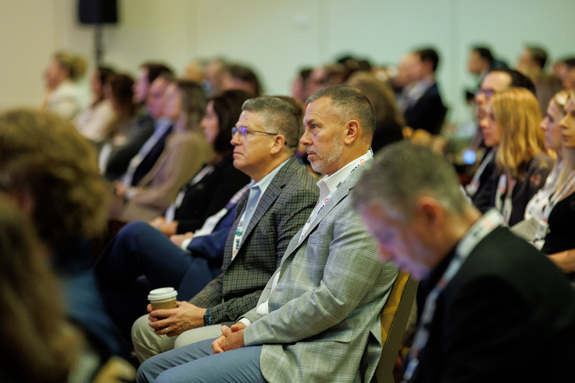 Pharmaceutical professionals seated and watching a session at Access USA