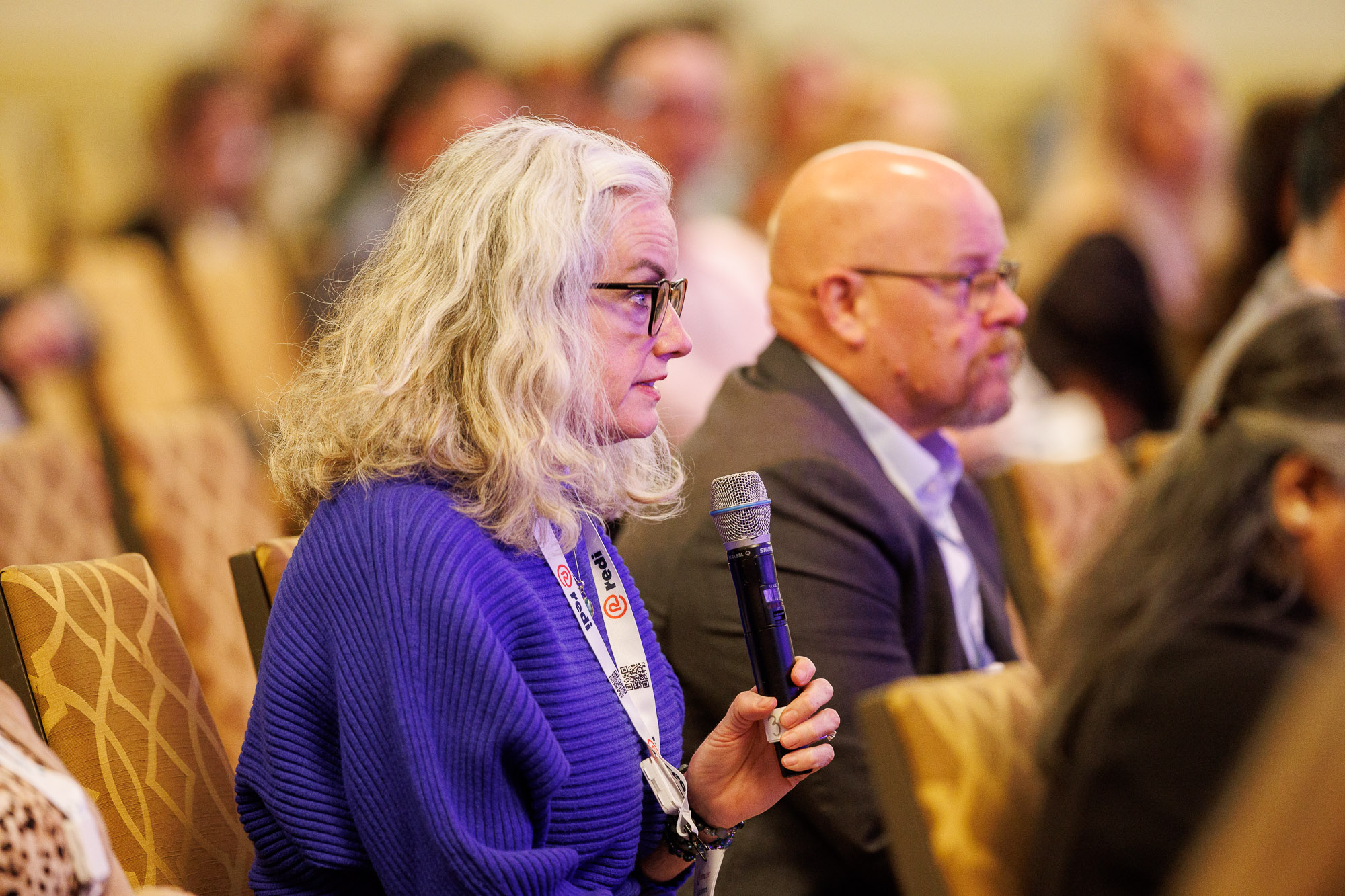Attendee asking a question at the Patient Assistance & Access Programs conference
