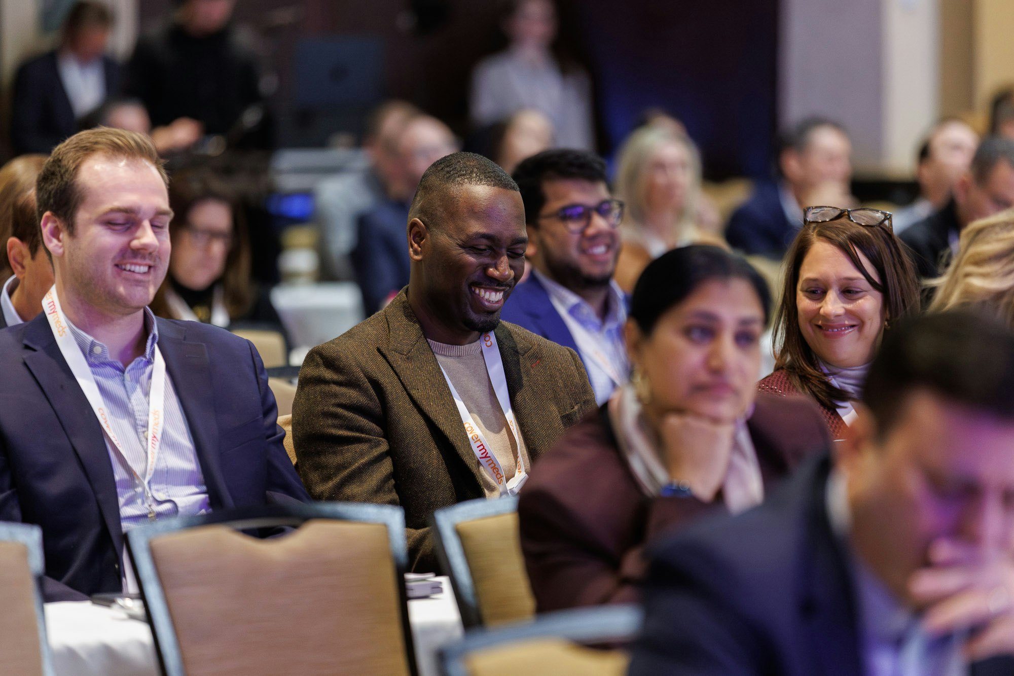Patient access professionals enjoying conference presentation