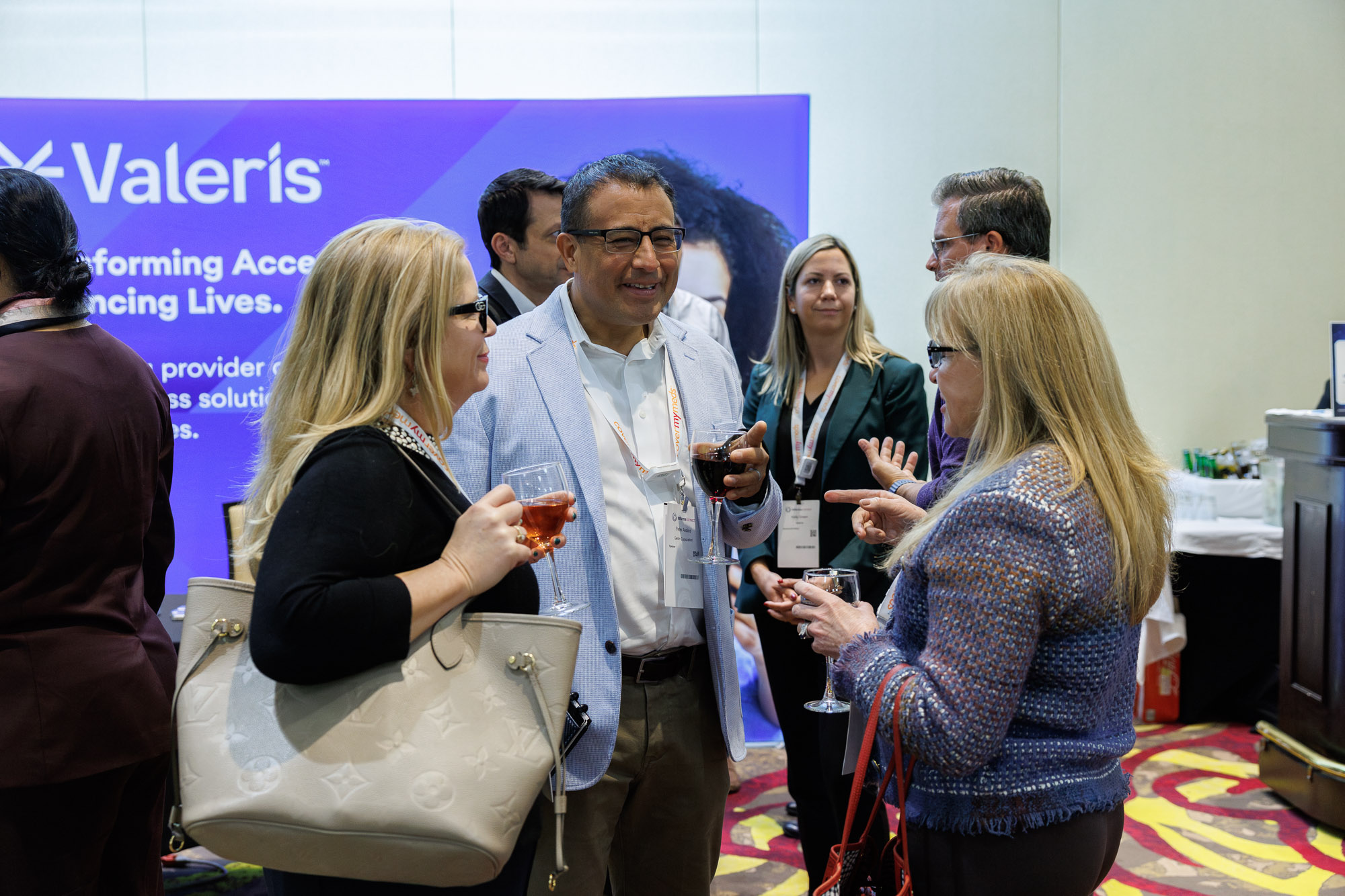 Access professionals networking at a pharma conference