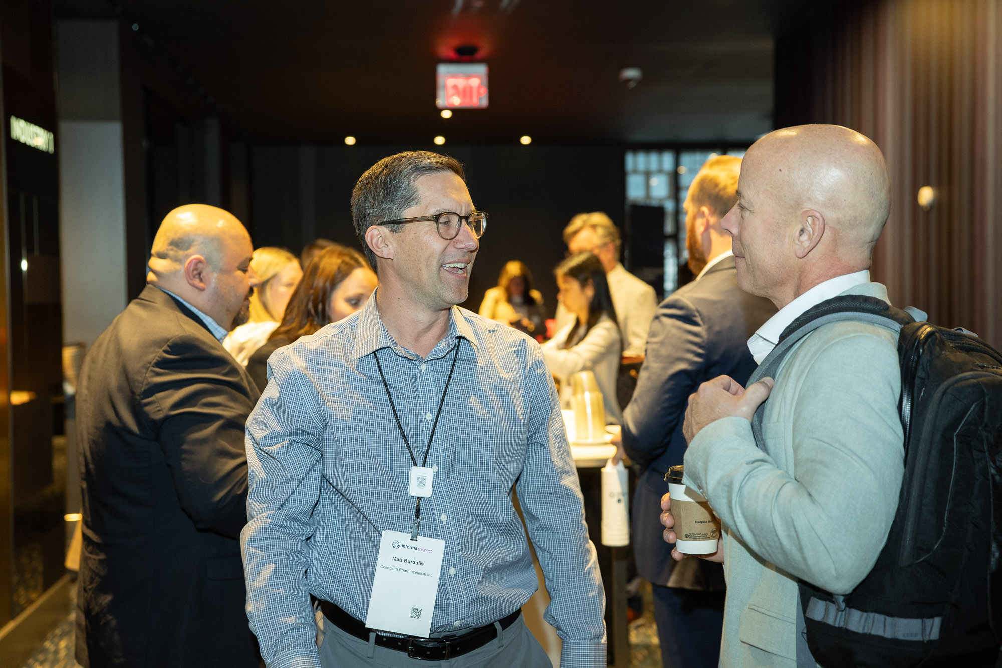 Two pharmaceutical professionals network at Trade and Channel Strategies