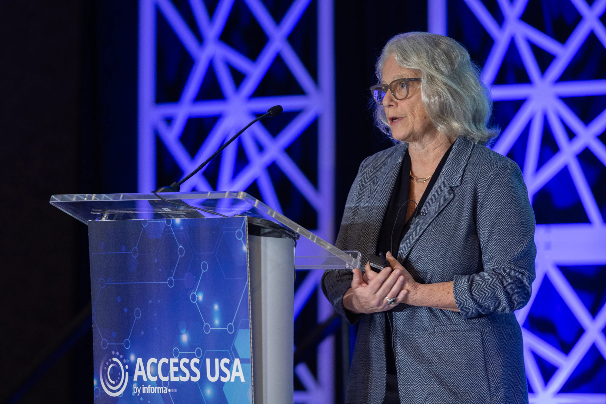A female pharmaceutical professional addressing conference at Access USA