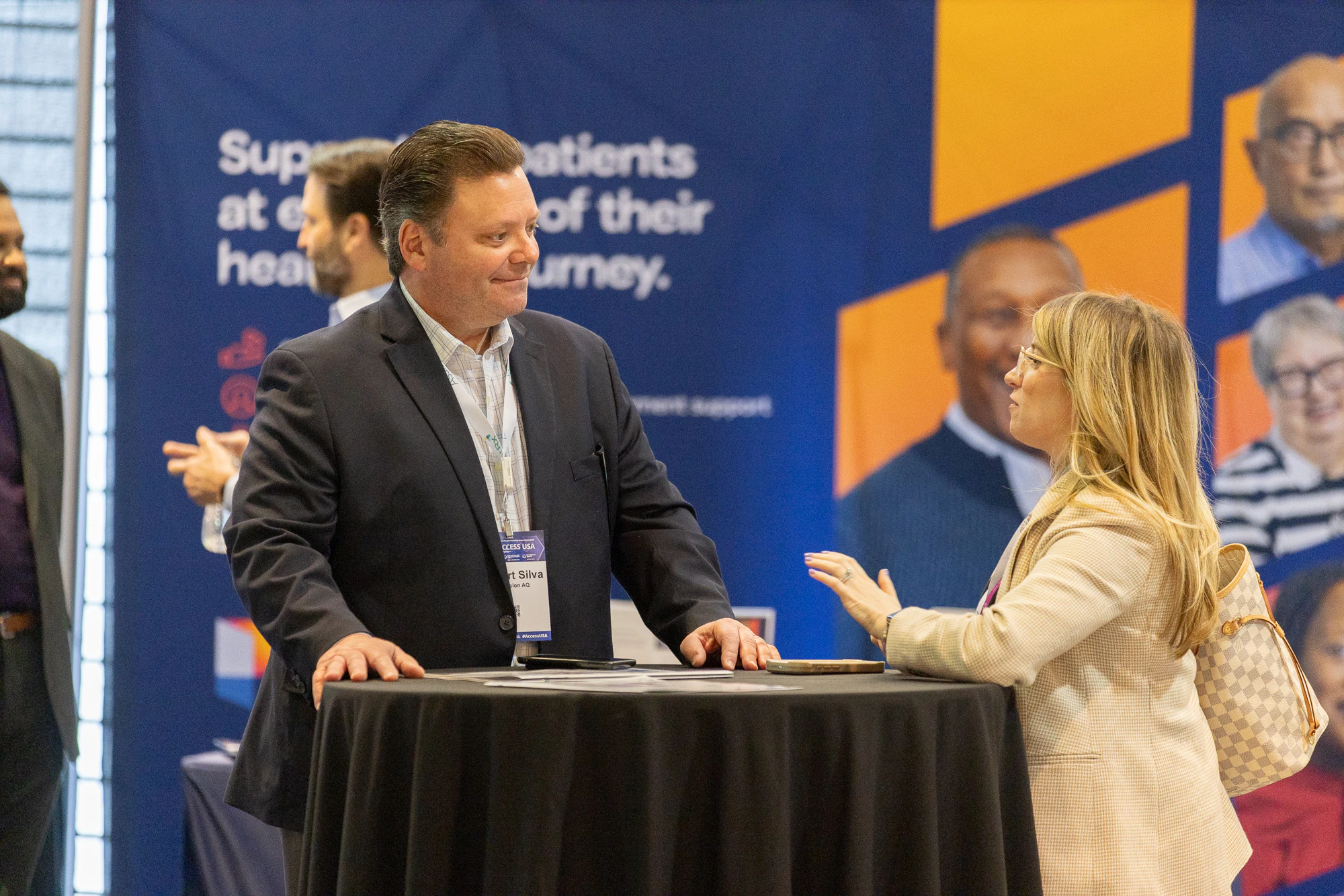 Attendees in discussion at Patient Assistance & Access Programs