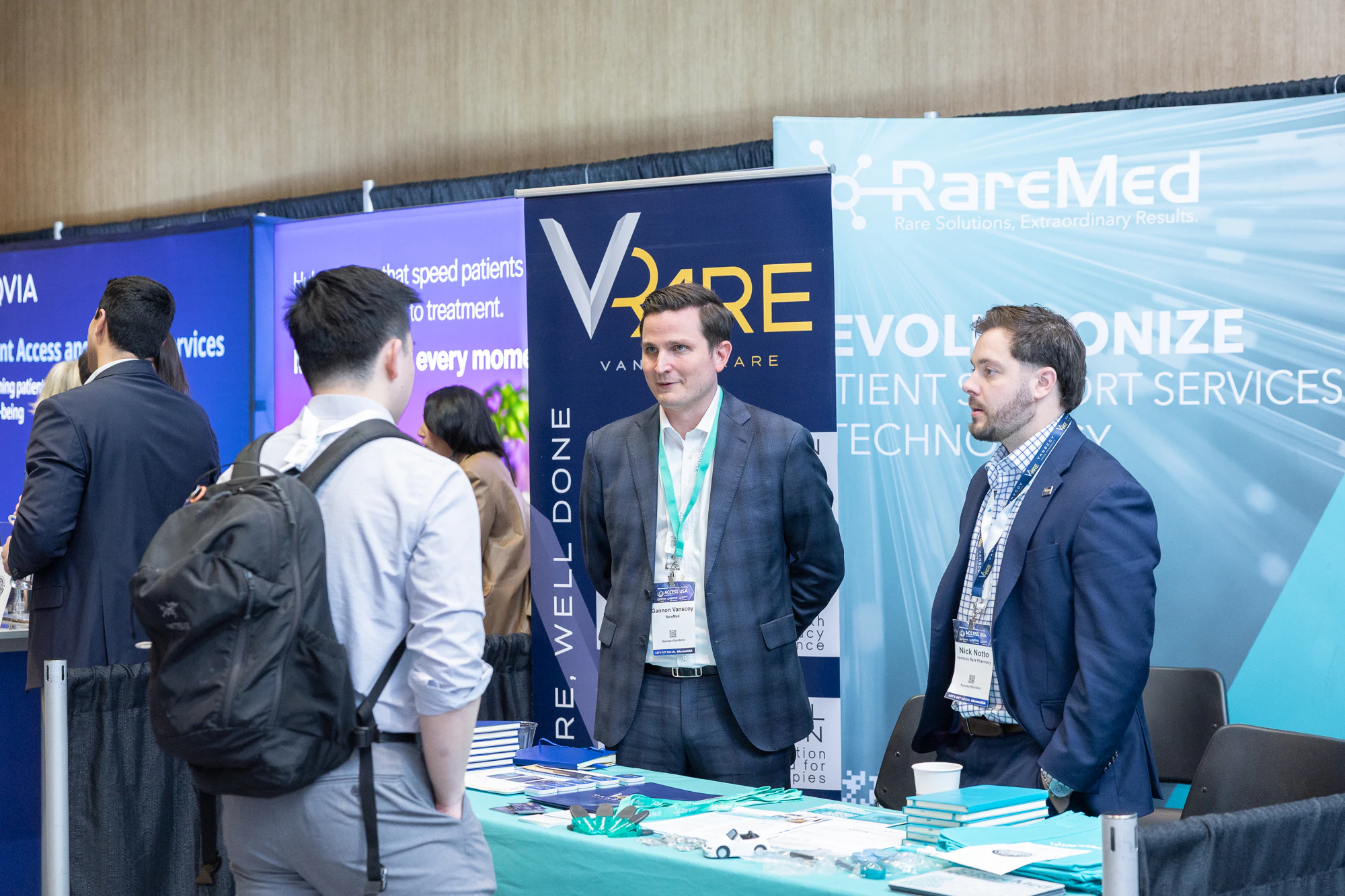 Pharmaceutical professional networking in the exhibit hall at Patient Assistance & Access Programs conference